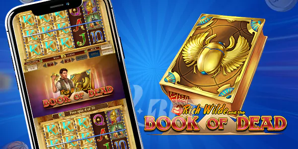 a gold book and phone with game of book of dead